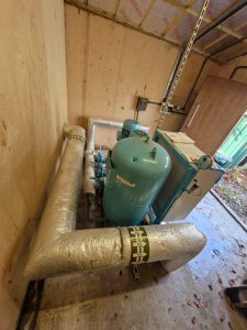 Booster pump in a storage room of a holiday park